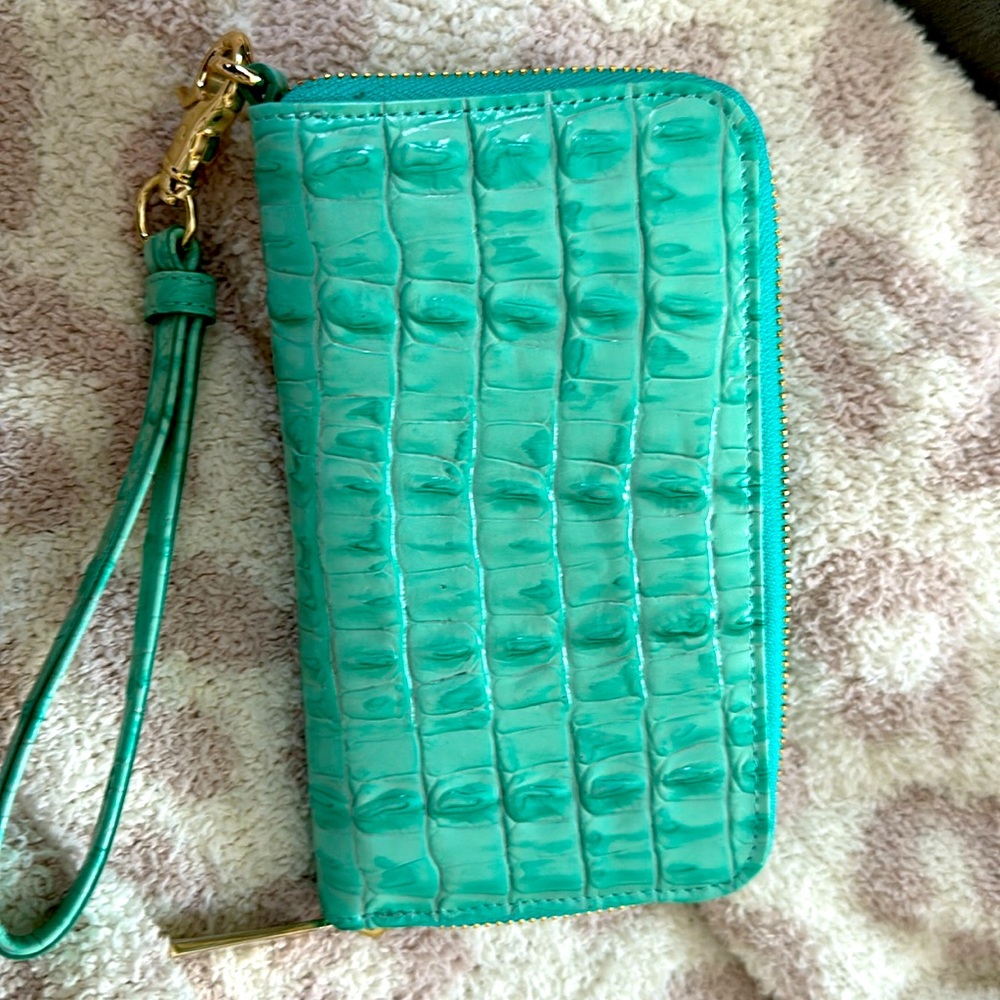 Small teal green Brahmin zip around wristlet wallet.
